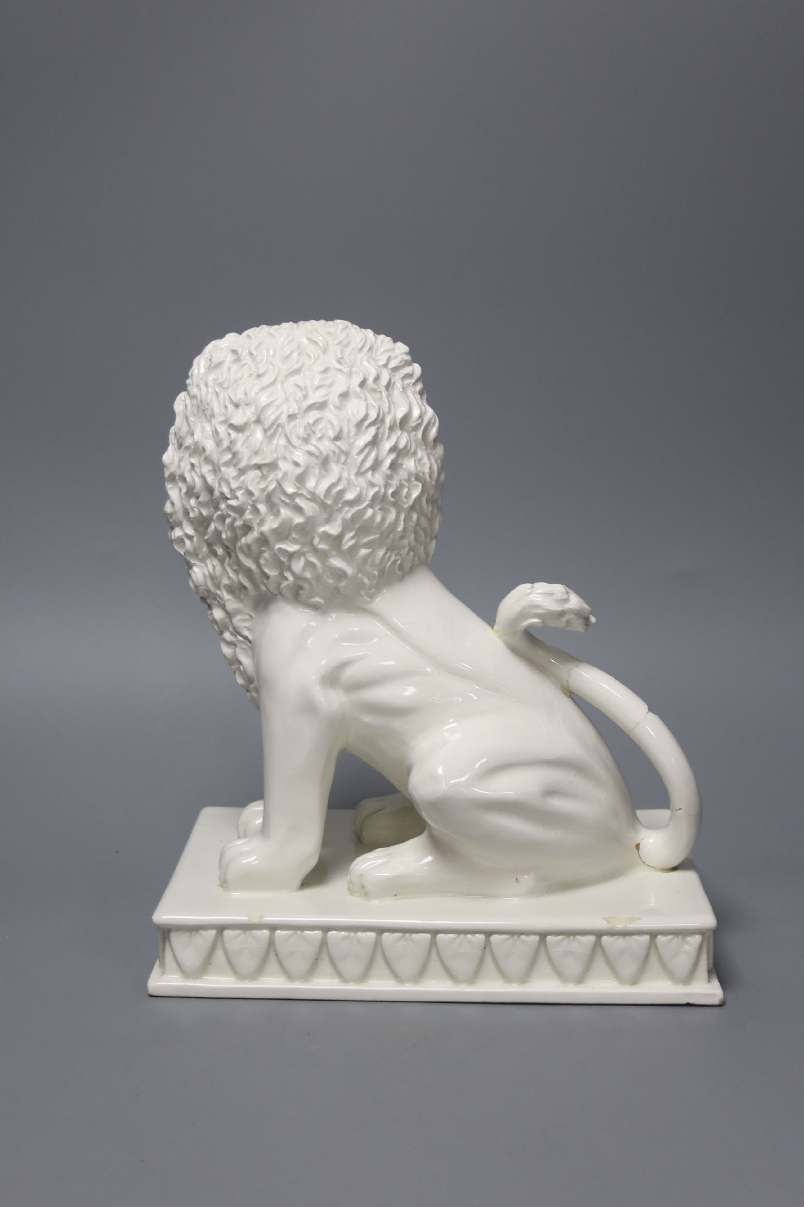 An Italian tin glazed pottery seated lion, height 25.5cm